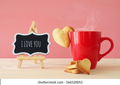 Valentines Day Background. Cup Of Coffe And Heart Shape Cookies On The Table