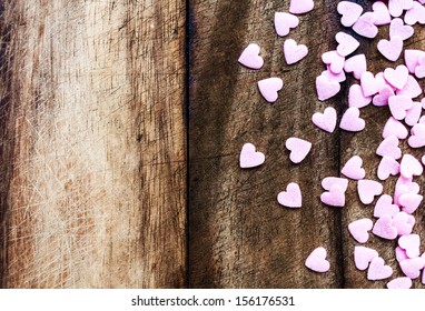 Valentines Day background with hearts. Sugar Hearts on wooden vintage textured background or table.  - Powered by Shutterstock