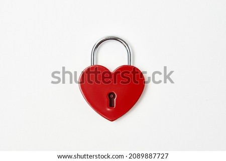 Valentines day background with red heart shaped lock and key. Love symbol heart padlock