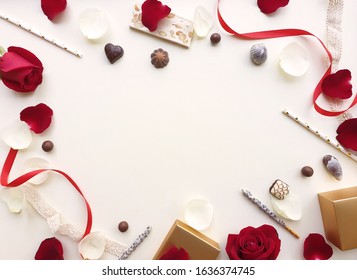 Valentines Day Background. Rose, Rose Petals,chocolate,tube And Ribbon Beautiful. Isolated On Pastel Pink Backgrounds. Valentines Day Concept. View From Above. There Is A Middle Area On Pink Floor.