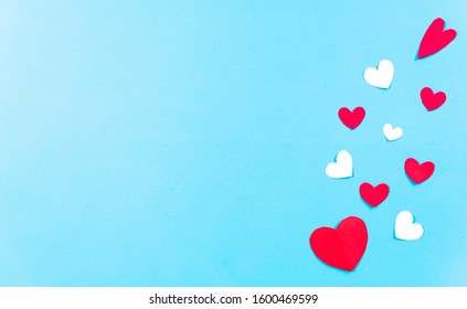 Valentines Day background. White and red hearts on pastel blue background. Valentines day concept. Top view,  copy space. - Shutterstock ID 1600469599