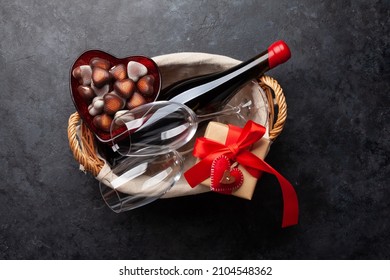 Valentines day basket with wine and chocolate. Top view flat lay