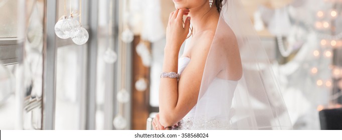 valentine's day, bridal, wedding, christmas, x-mas, winter, happiness concept - bride looking at window.