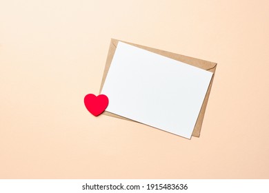 Valentines Day Card Mockup With Envelope And Red Heart On Paper Background