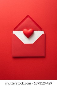 Valentines Day Card With Red Heart And Envelope On Red Background Top View