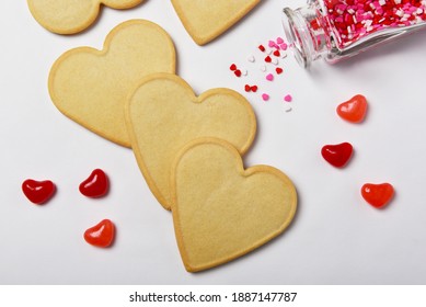 Valentines Day Concept: Fresh Baked Heart Shaped Cookies Ready For Decorating With Candy Hearts.