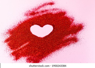 Valentine's Day concept. Heart shaped painted by on red glitter. - Powered by Shutterstock