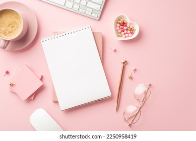 Valentine's Day concept. Top view photo of planners golden pen glasses heart shaped saucer pushpins sticky note paper keyboard and mug of coffee on isolated pastel pink background with copyspace - Powered by Shutterstock