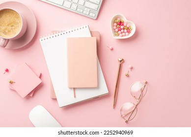 Valentine's Day concept. Top view photo of reminders golden pen glasses heart shaped saucer pushpins sticky note paper keyboard computer mouse and mug of coffee on isolated pastel pink background - Powered by Shutterstock