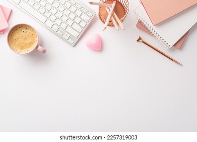 Valentine's Day concept. Top view photo of workstation keyboard stack of notebooks pencils holder pen heart shaped candle and cup of frothy coffee on isolated white background with copyspace - Powered by Shutterstock
