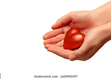 Valentine's day concept. a woman's hand holds a heart on a white background.