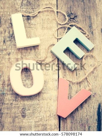 Valentine's day concept with wooden letters love/toned photo