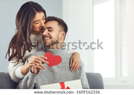 Valentine's day. Couple gives heart to the Valentine's Day in the room.