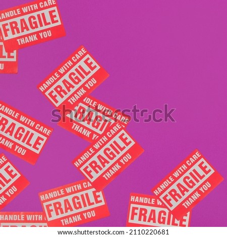 Valentines day creative pattern made with Fragile Warning Sticker Labels on bright purple background. 80s, 90s retro romantic aesthetic love concept. Minimal fashion idea.