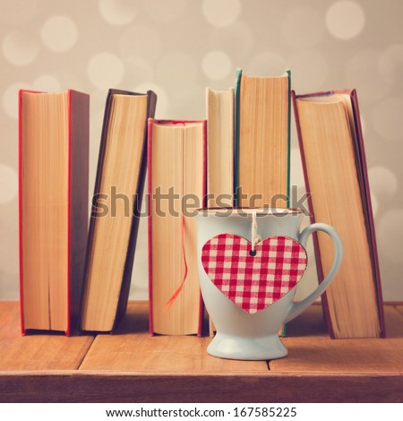 Valentine's day cup with heart shape and books