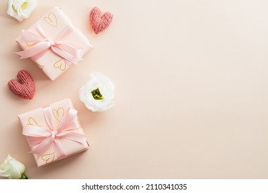 Valentines Day flat lay composition. Valentines gifts and rose buds on beige background. Minimalist style. - Powered by Shutterstock