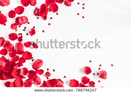 Valentine's Day. Flowers composition. Round frame made of rose flowers, confetti on white background. Valentines day background. Flat lay, top view, copy space.
