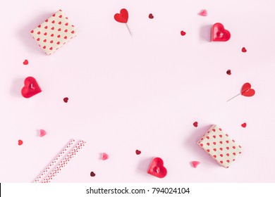 Valentine's Day. Frame Made Of Gifts, Candles, Confetti On Pink Background. Valentines Day Background. Flat Lay, Top View, Copy Space.