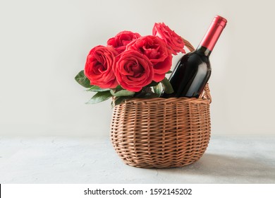 Valentines Day Gift Hamper, Bouquet Of Red Roses, Bottle Of Red Wine On White. Close Up. Horizontal Format. Space For Wishes.  Hamper Ultimate Gift.