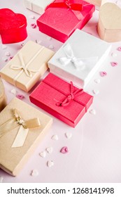 Valentines day gifts boxes background, frame for holiday greeting card background, with confetti  candy hearts, flat lay, top view, copy space - Shutterstock ID 1268141998