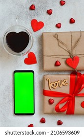 Valentines Day Greeting Card, Festive Gift Box With Red Ribbon And Wooden Decorations Shape Heart, Eco Friendly Craft Package And Zero Waste Holiday, Green Screen Cell Phone Chroma Key.