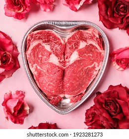 Valentine's Day heart ribeye raw beef steak with roses romantic date night  - Shutterstock ID 1923281273