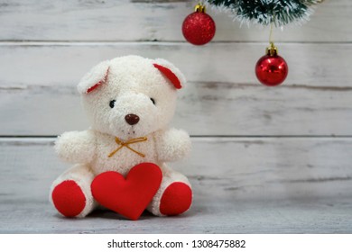 Valentines Day And Love Concept. White Bear Holding Red Heart  With Plank Wood Board Background