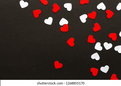 Valentines day. Paper hearts red and white on a black background. Holiday background - Shutterstock ID 1268855170
