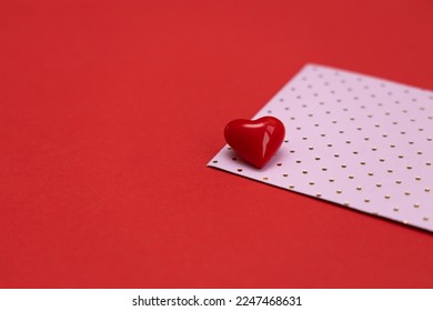Valentines day red heart on pink dots envelope. Vivid color. Valentine's day concept. Copy space. Space for text. - Powered by Shutterstock