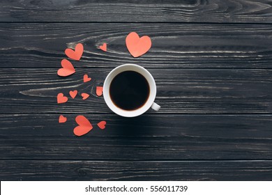 Valentines Day, Red Paper Hearts And A Cup Of Coffee On A Dark Wood Background. 