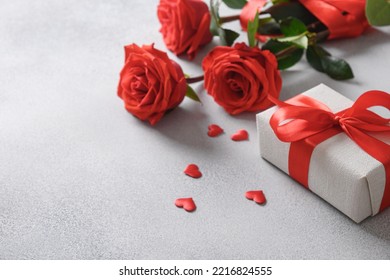 Valentine's day romantic gift, bouquet of red roses on gray background. Close up. Greeting card. - Shutterstock ID 2216824555
