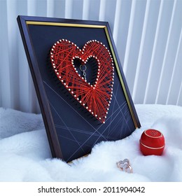 Valentine's Day String Art Red Heart Framed. Valentine String Art. Valentine's Day Gift Of A Painting In The Style Of String Art. Hobby. Key From The Heart. Heart Of Red Threads. Weaving