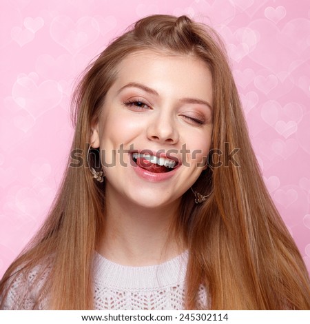 Sweet Blonde Woman Winking And Smiling Funny With Her Teeth Heart Sweet Blonde Woman Winking And Smiling Funny With Her Teeth Heart