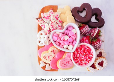 Valentines Day Sweets And Cookies. Top View In A Serving Platter Over A White Marble Background. Love And Hearts Theme.