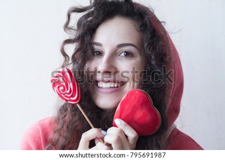 Valentines Day. Woman with red lollipop on white background. Winter concept with copy space. 