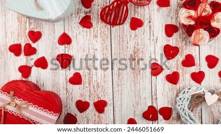 Valentine's Day wooden background. Gifts, candles, confetti, on woodenbackground. Valentine's Day concept. Flat lay, top view, copy space