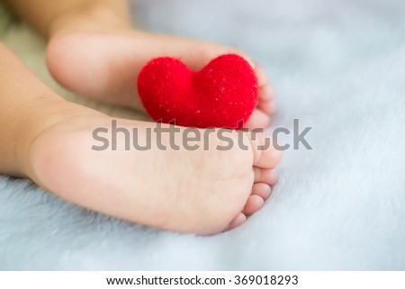 Valentune's Day,Baby's feet with a red heart