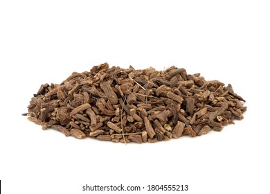 Valerian herb root used in herbal medicine as a tranquillizer and to treat insomnia, anxiety, hypertension, pain relief and is a muscle relaxant, on white background. Valeriana officinalis.