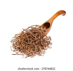 Valerian root on the wooden spoon.