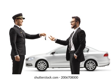 Valet returning car keys from a silver car to a businessman isolated on white background