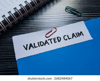 Validated claim writting on table background.