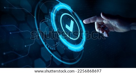 Validation concept for business process automation, quality assurance management, certification, digital transformation. Finger touching checked icon on virtual screen interface.