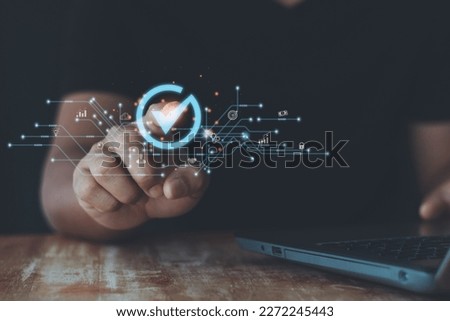 Validation concept for business process automation, quality assurance management, certification, digital transformation. businessman touching checked icon on virtual screen. Business service guarantee