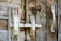 VALLDAL, NORWAY - 2020 JUNE 06. Old Rustic Handmade Wooden Door Handler.