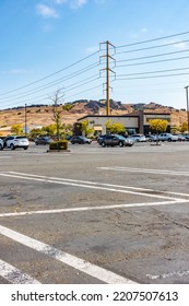 Vallejo, California - July 23 2022: Overhead Power Cables Held By Pylons Alongside A Parking Lot At A Strip Mall In Vallejo, California