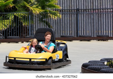 VALLEJO, CALIFORNIA, USA - JUNE 14, 2016:  Six Flags Theme Park,  Mom And Doughter Driving Thunder Road Speedway Go-Karts Racing Track
