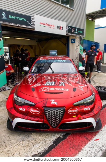 Vallelunga, Italy, June 19 2021, Pure ETCR\
Championship. Alfa Romeo Ferraris team electric racing car in\
asphalt circuit pit\
lane