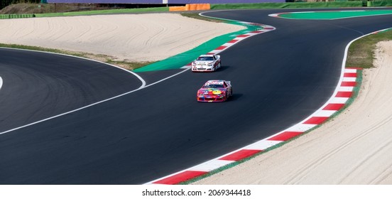 Vallelunga, Italy, October 29 2021. American Festival Of Rome Car Racing Motor Sport Weekend. High Angle View Nascar Racing Cars On Straight Racetrack, Large View Copy Space