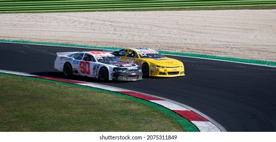 Vallelunga, Italy, October 30 2021. American Festival Of Rome. Nascar Cars Battle Challenging On Asphalt Racetrack, Overtaking At Turn