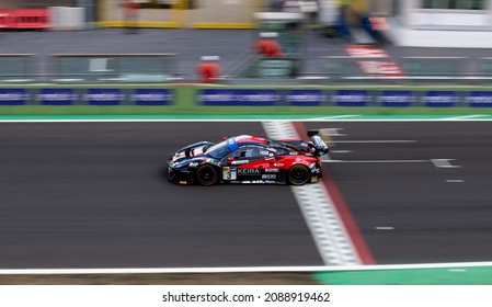 Vallelunga, Italy September 18th 2021 Aci Racing Weekend. Ferrari Gt Race Car Crossing Checkered Sign High Angle View Of Straight Racetrack Blurred Background